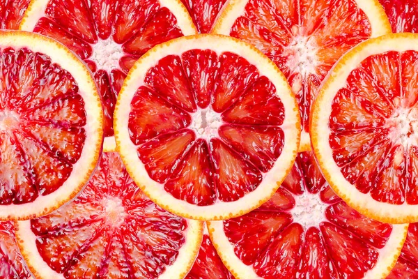 切碎血淋淋的橙子质地 新鲜成熟的红色镰状橙子 柑橘类水果为背景 — 图库照片