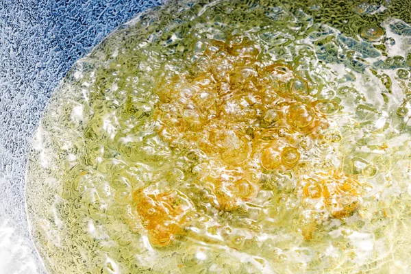 Boiling oil in pan for cooking street food