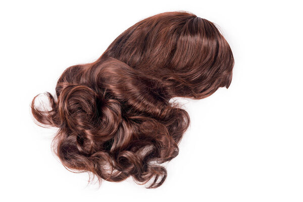 Female chocolate brown wig isolated on white background. Golden brown human hair weaves, extensions and wigs. Woman beauty concept