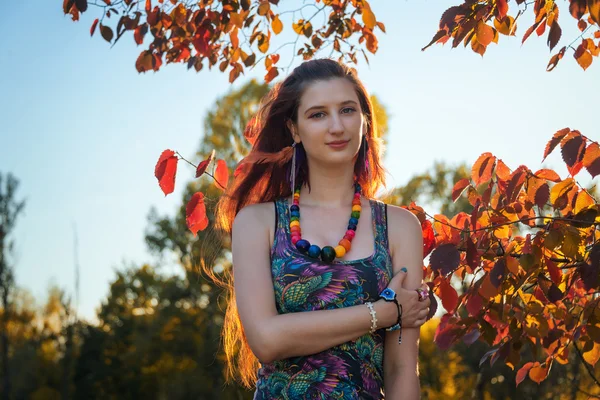 Fashion portrait of young hippie woman walking in autumn field. Romantic sunny evening — Stock Photo, Image