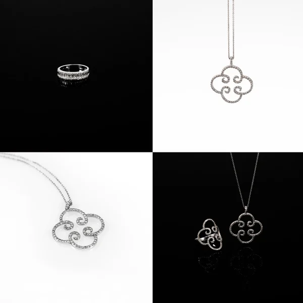 Luxury jewellery. White gold or silver rings and pendants isolated. Selective focus. — Stock Photo, Image