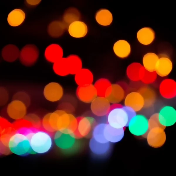 Karanlık bir arka plan üzerinde renkli bokeh. Ufuk bokeh lignts. Soyut Noel batskground. Soyut dairesel bokeh arka planını Christmaslight. — Stok fotoğraf