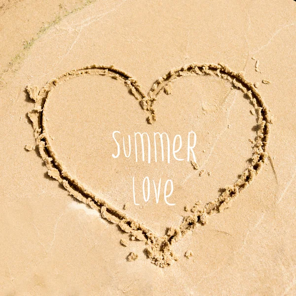 Summer time greeting card design. Shape of the heart drawn in the sand on the beach. — Stock Photo, Image