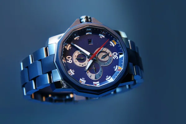 Swiss watches on blue background. Product photography. — Zdjęcie stockowe