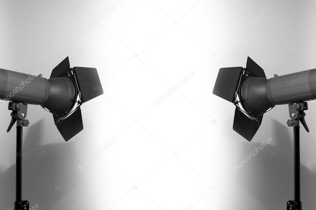 Empty white studio background and flashlights on light grey with place for your text. Spotlights against blank white empty wall.