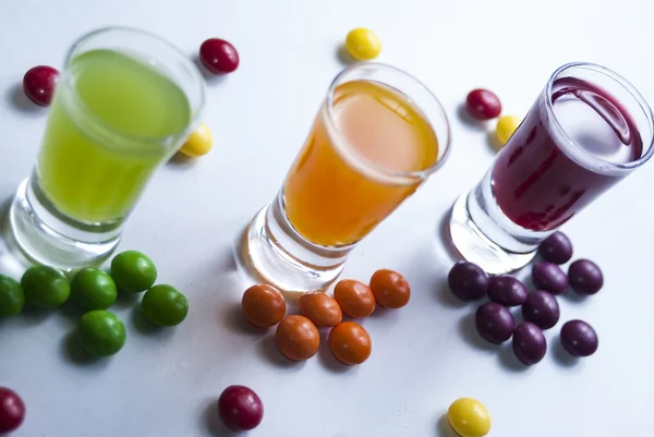 Vodka with colorful candy — Stock Photo, Image