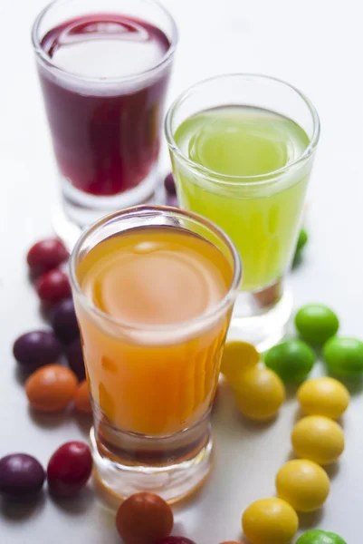 Vodka with colorful candy — Stock Photo, Image