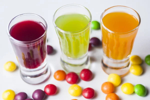 Vodka with colorful candy — Stock Photo, Image