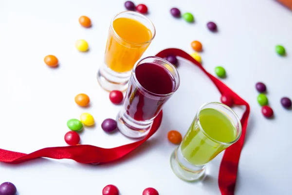 Vodka with colorful candy — Stock Photo, Image