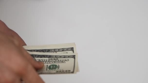 Close up view of man's hands count hundred dollar bills and give some money away — Stock Video