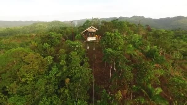 Aerial birds eye view of a zipline over tropical forest — Stock Video