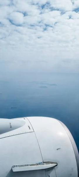 Wings aircraft with blue sky ,top view. view of the airplane wing at the airport