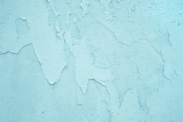 Hellblaue oder türkisfarbene alte Wand mit Peeling-Farbe. — Stockfoto