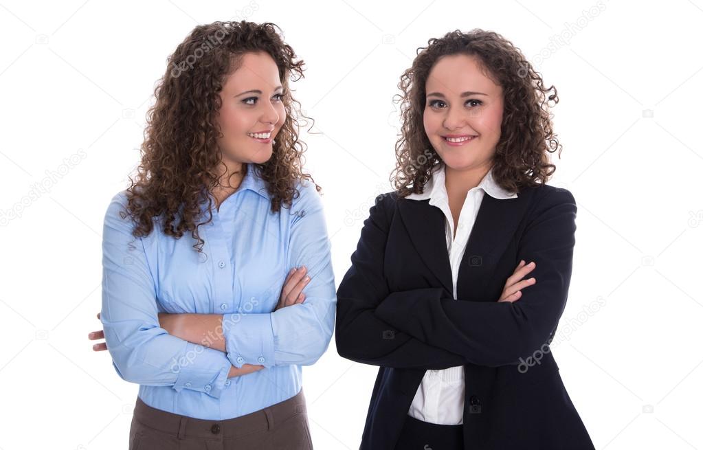 Teamwork concept: twins as businesswoman isolated over white.