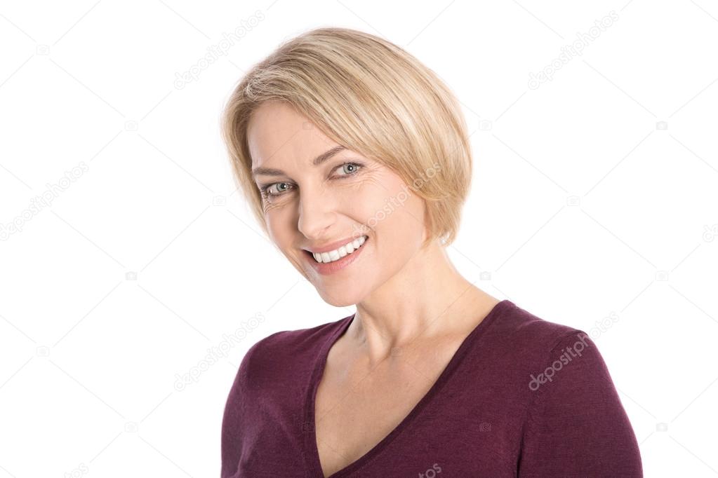 Portrait: isolated face of a smiling attractive older blond woma