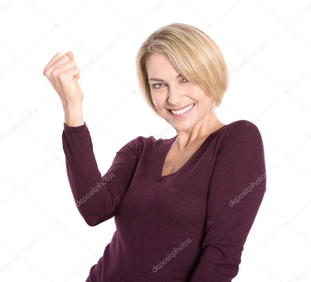 Isolated successful and happy older woman in pullover.
