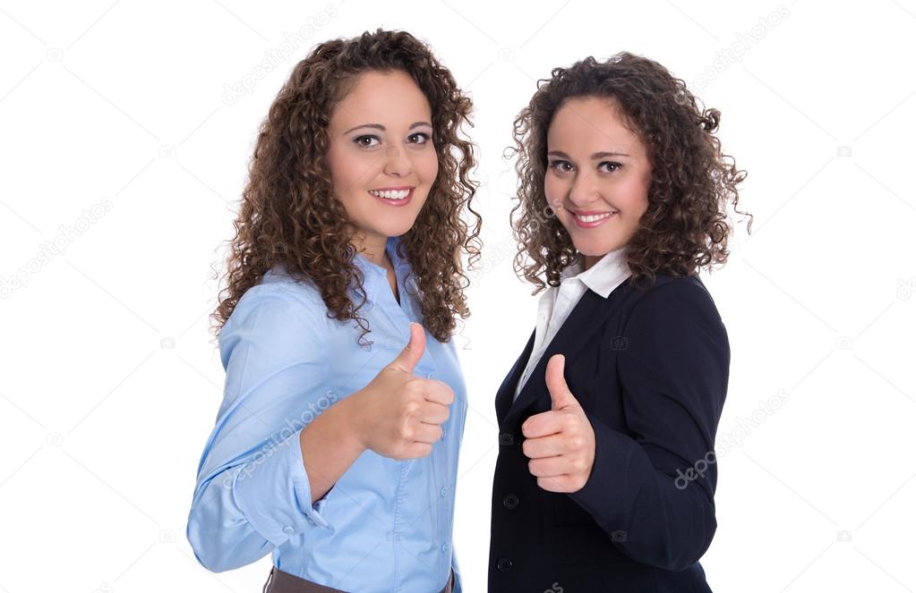 Successful business team: two isolated woman - real twins.
