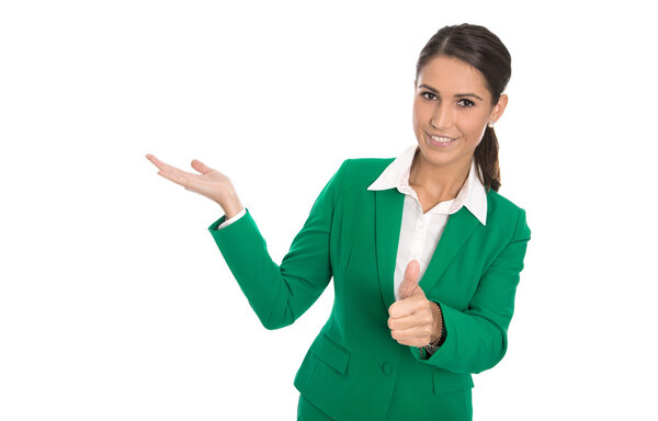 Presenting isolated businesswoman in green dress with thumb up.