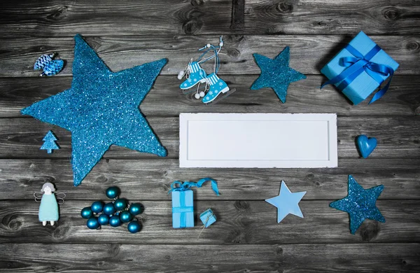 Blue wooden christmas advertising board with decoration. — Stock Photo, Image