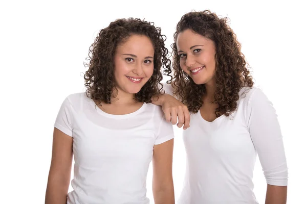 Portrait of real twin sisters isolated over white. — Stock Photo, Image