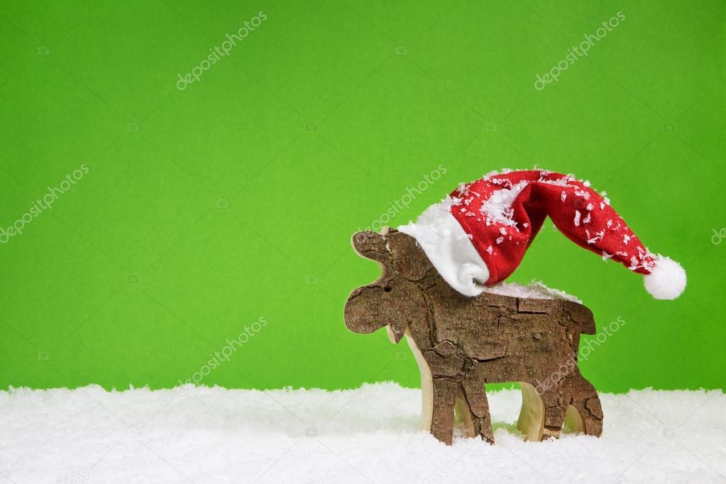 Christmas greeting card with reindeer in green red and white col