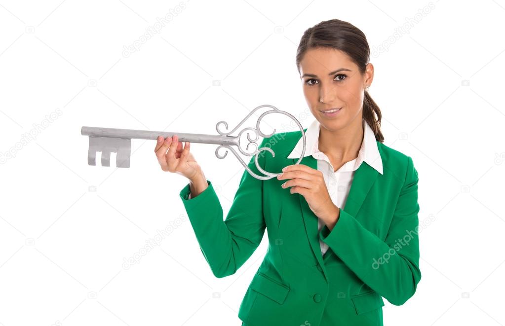 Isolated business woman in green holding key for dedicate a hous