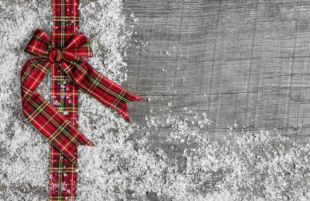 Country style christmas background with red green checked ribbon