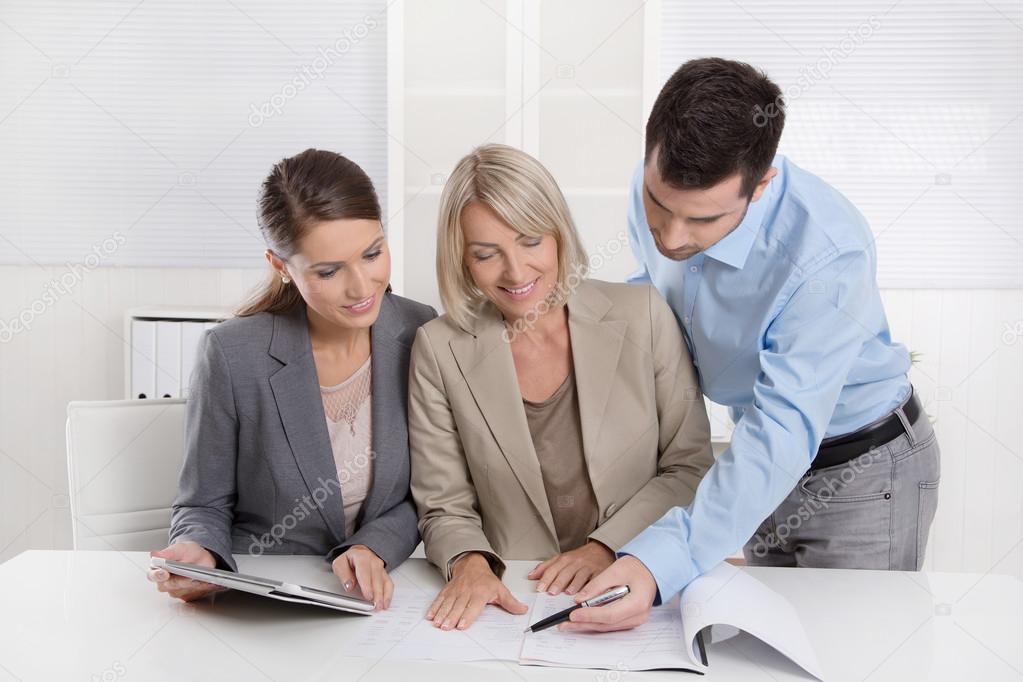 Business Team: Man and woman group in a meeting talking about fa