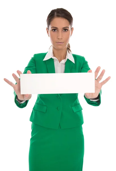 Grave donna d'affari isolata in verde holding message board i — Foto Stock