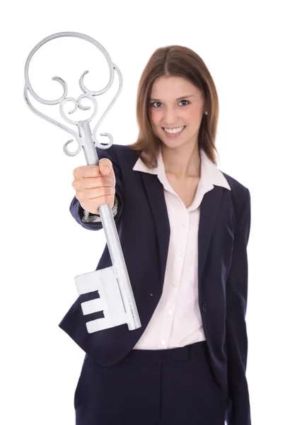 Successful young businesswoman holding a key: concept for succes — Stock Photo, Image