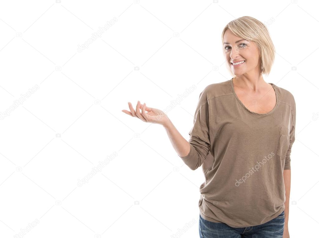 Pretty isolated older woman presenting with hand over white.