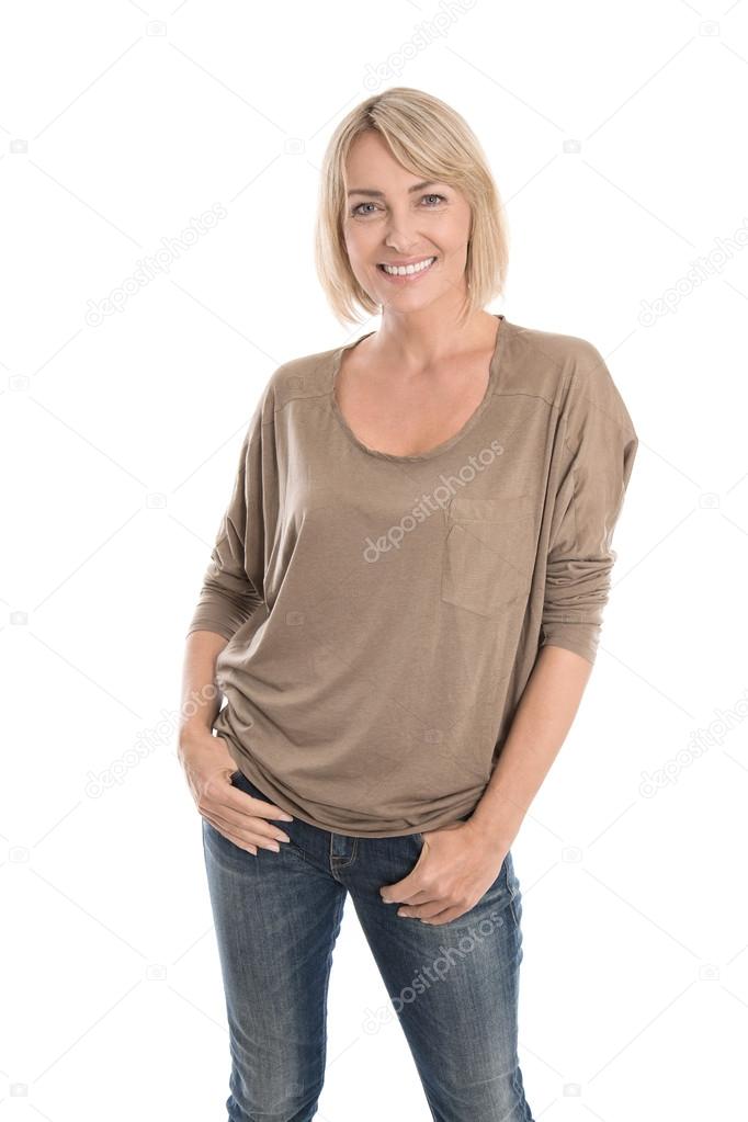Happy middle age blond woman in blue jeans isolated over white.
