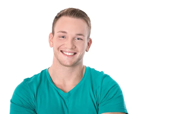 Gelukkig geïsoleerde jonge blonde man in het groene shirt glimlachen: witte tee — Stockfoto