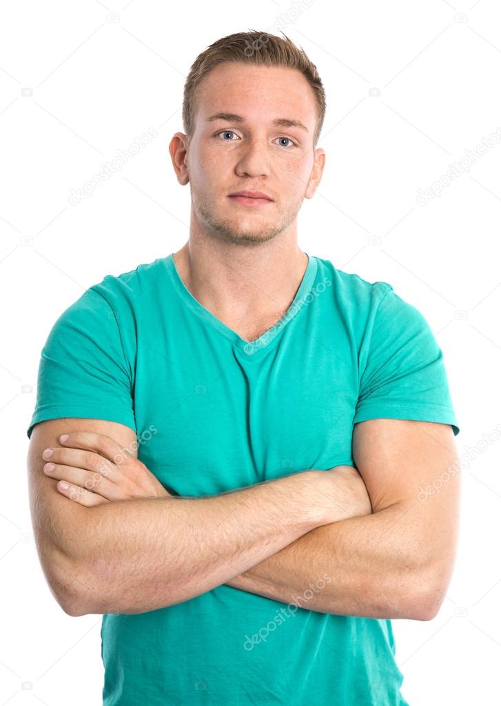 Cool isolated young sportive blond man in green shirt.