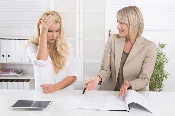 Young female trainee had made an error at work and her boss crit