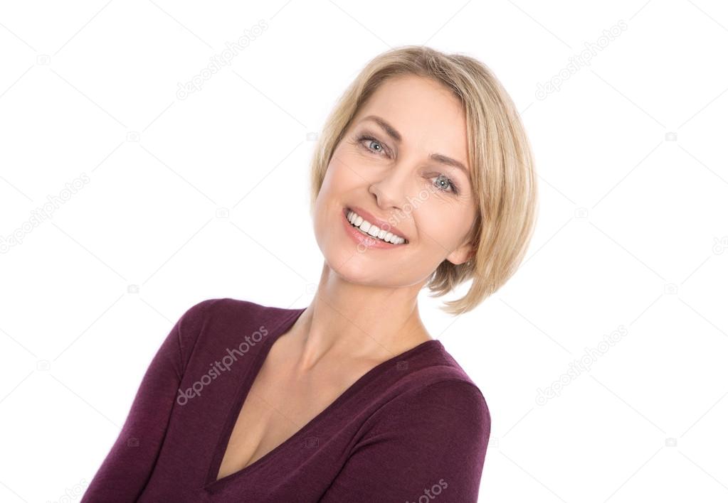 Lucky isolated blond mature woman with white teeth and pullover 