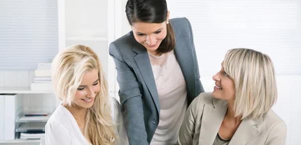 Successful team of well educated businesswoman sitting at desk w — Stock Photo, Image
