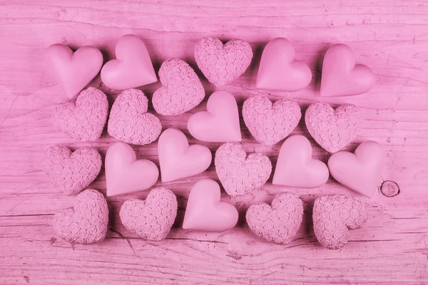 粉色木制背景的情人节那天的 h 集合 — 图库照片