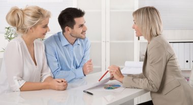 Young couple customers and adviser or agent talking about financ