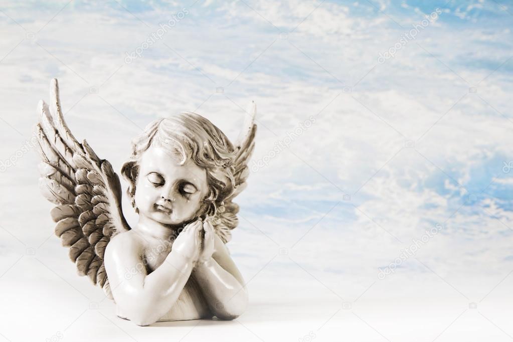 Sad angel on a background for a greeting card.