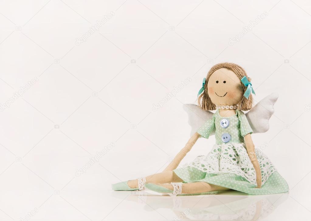 Isolated doll or puppet like a guardian angel.