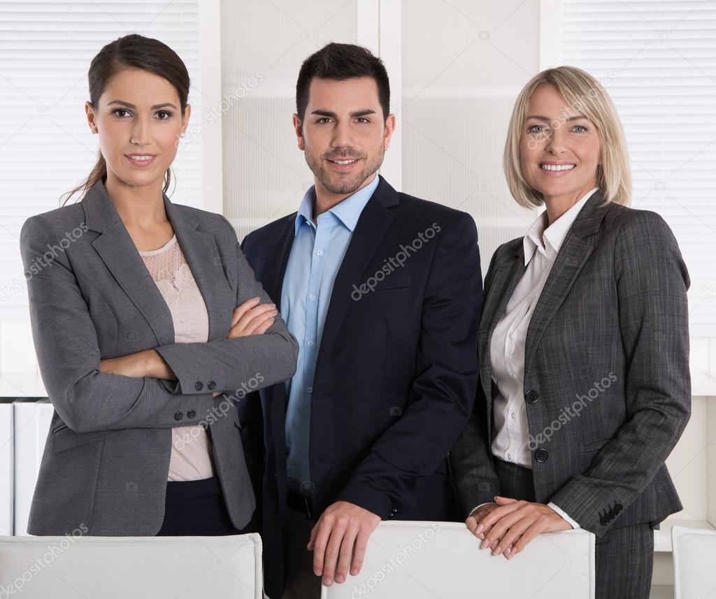 Portrait of three business people: man and woman in a team.