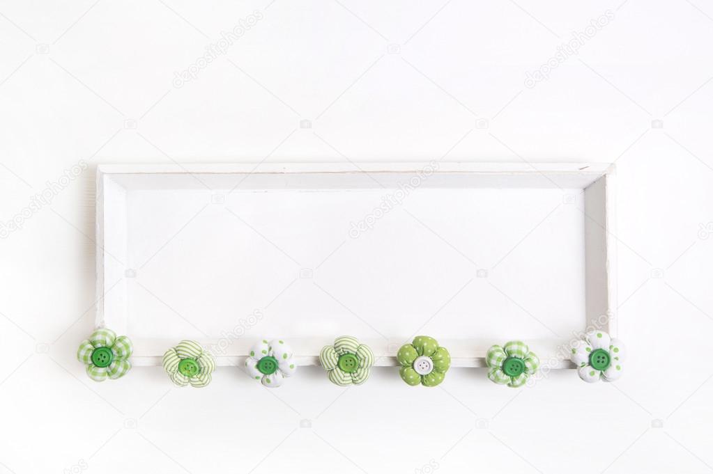 Spring or easter background with handmade flowers on a white woo