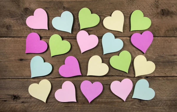 Collection on many colorful hearts on wooden background for love — Stock Photo, Image