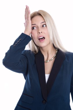 Shocked and disappointed young business woman holding her hand to the head.