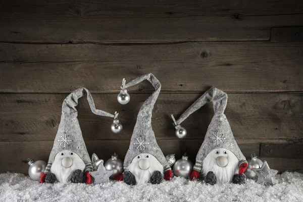 Three handmade gimps on wooden background for christmas decorati — Stock Photo, Image