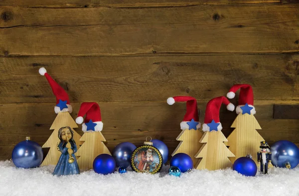 Trä jul bakgrund med röda, vita, bruna och blå deco — Stockfoto