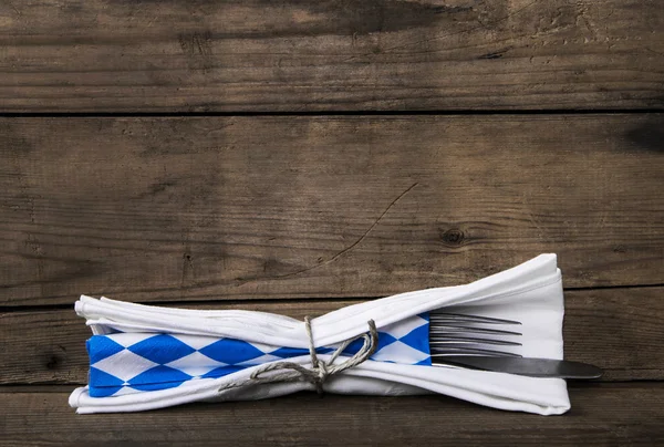 Bavarian food. Old wooden background with knife and fork. Table — ストック写真