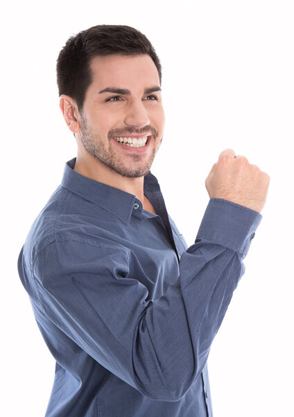 Proud and successful young business man making fist gesture isol