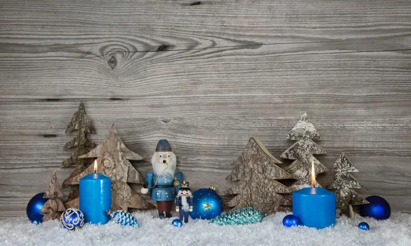 Wooden christmas background in grey with blue turquoise nutcrack Stock Picture